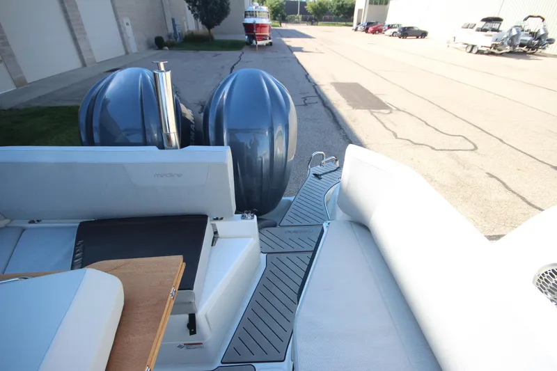 Slide: The Image of 2024 Zodiac MEDLINE 9 NEO boat with twin 300hp engines, docked outdoors. - 8