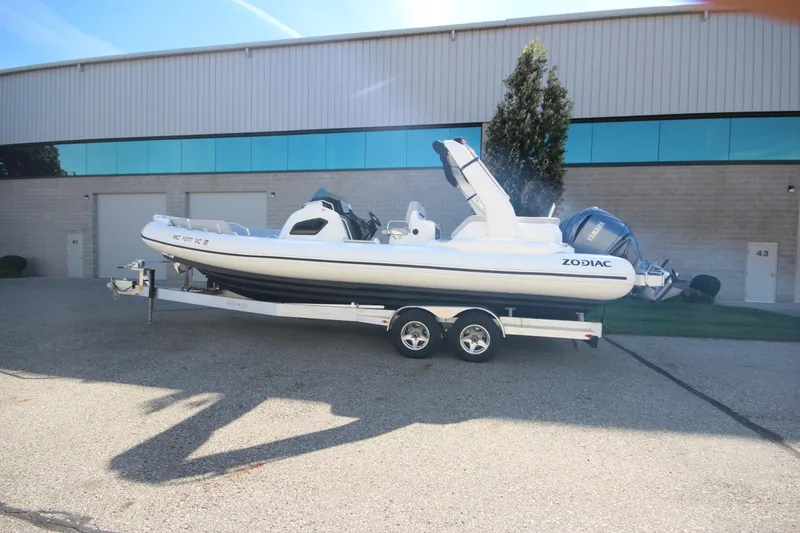 Slide: The Image of 2024 Zodiac MEDLINE 9 NEO Twin 300hp boat on trailer, parked outside a building. - 38