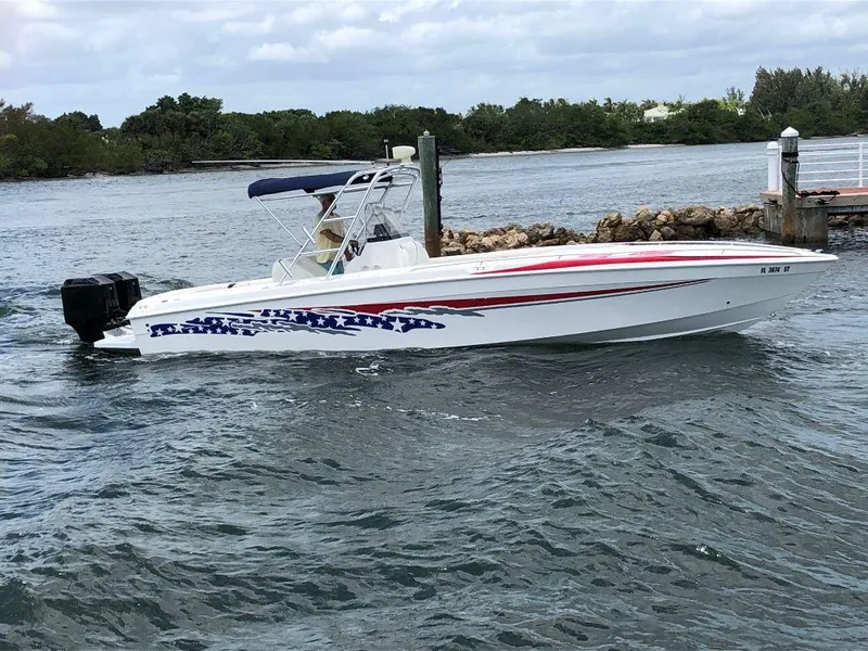 The Image of 1999 Wellcraft 302 Sport boat on water near dock, side view. - 0