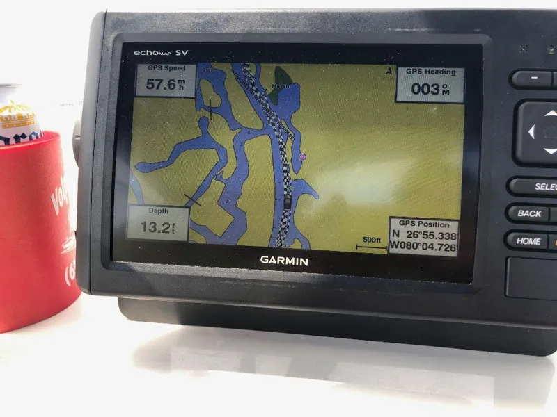 Slide: The Image of Garmin GPS on 1999 Wellcraft 302 Sport boat showing navigation map and coordinates. - 13