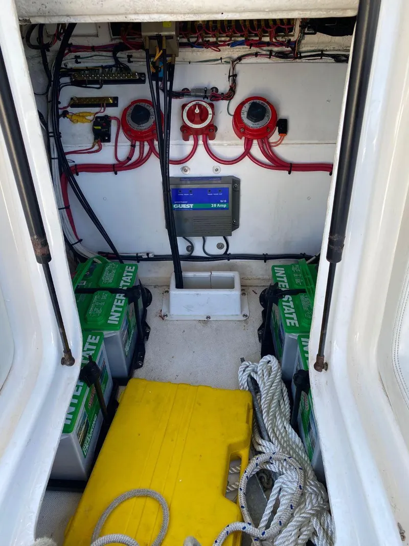 Slide: The Image of Battery compartment of a 1999 Wellcraft 302 Sport boat with wiring and equipment. - 5