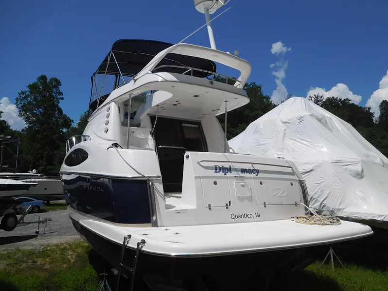 Slide: The Image of 2007 Regal 4080 Sportyacht docked outdoors under clear blue sky. - 10