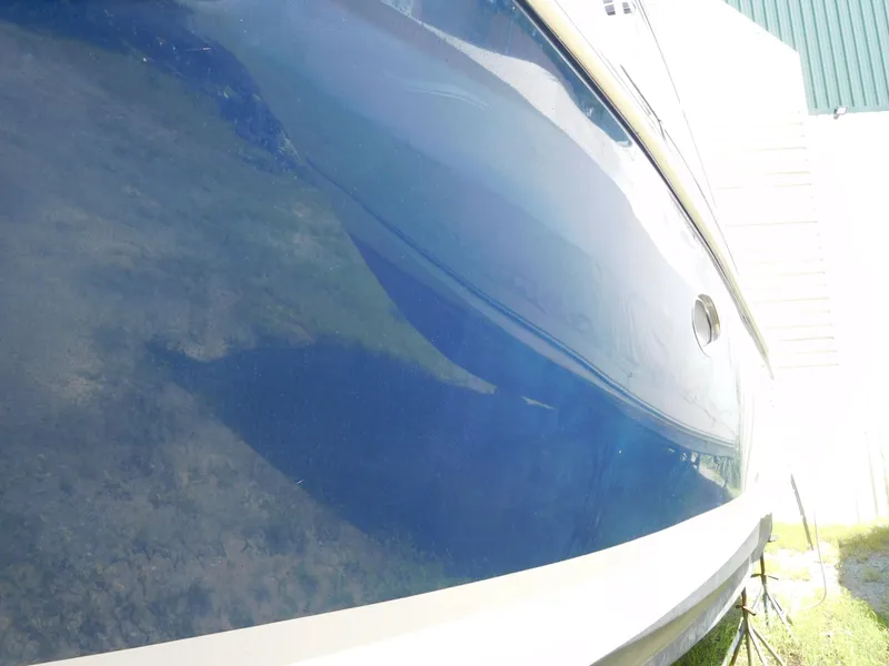 Slide: The Image of Close-up of a 2007 Regal 4080 Sportyacht's blue hull. - 15