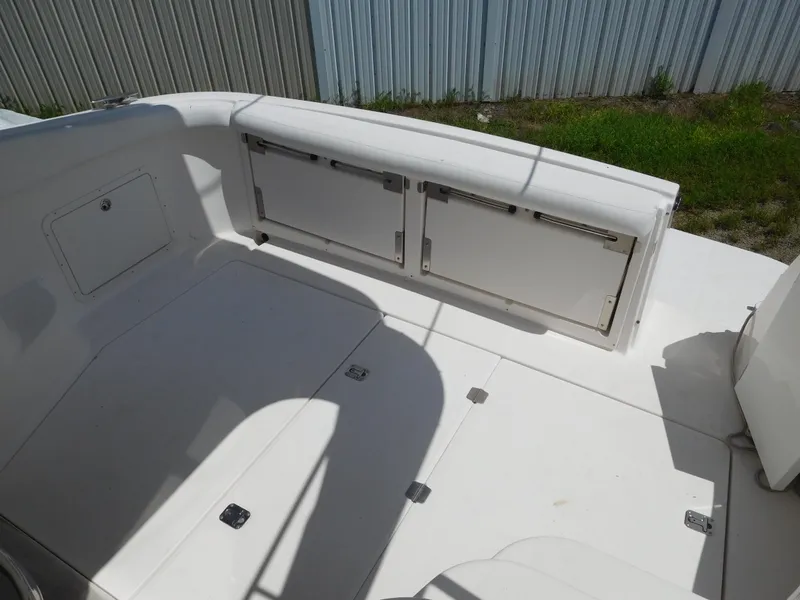 Slide: The Image of 2007 Regal 4080 Sportyacht deck with storage compartments and seating area. - 22