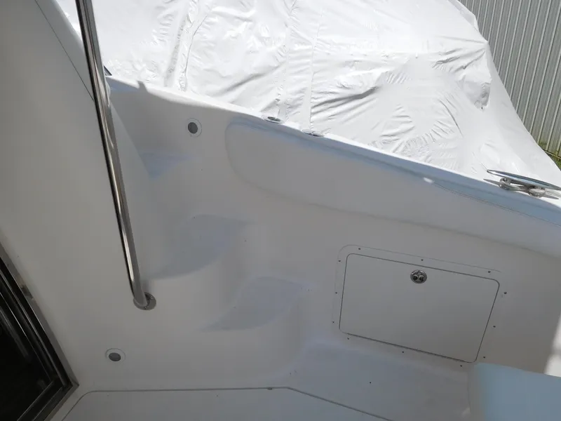 Slide: The Image of 2007 Regal 4080 Sportyacht deck area with railing and storage compartment. - 25