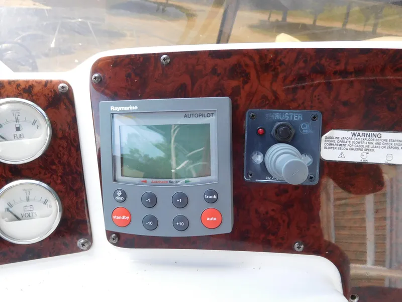 Slide: The Image of Control panel of 2007 Regal 4080 Sportyacht with autopilot and thruster controls. - 34
