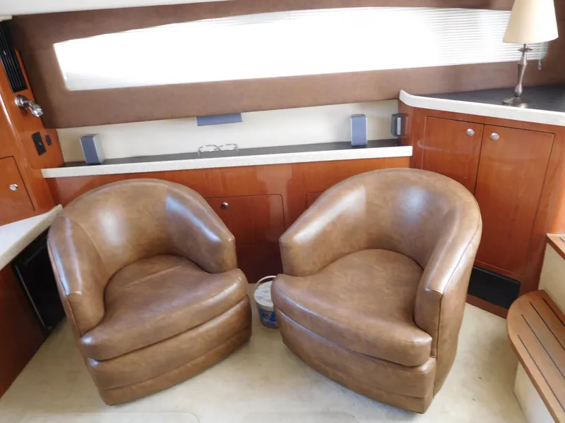 Slide: The Image of Luxurious interior of 2007 Regal 4080 Sportyacht with leather chairs and wooden cabinetry. - 40