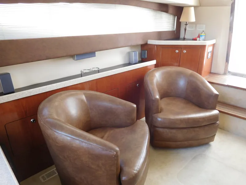 Slide: The Image of Luxurious interior of 2007 Regal 4080 Sportyacht with leather chairs and wooden cabinetry. - 41