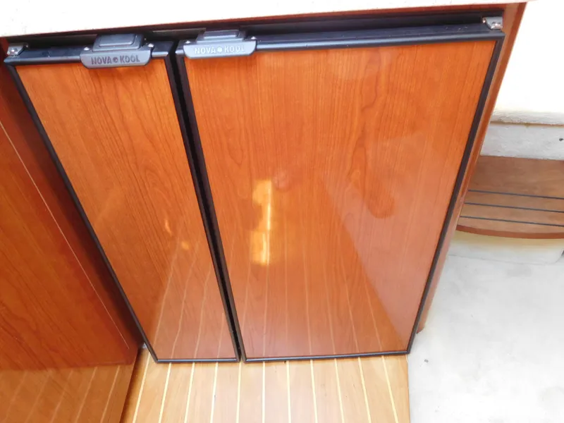 Slide: The Image of Wood-paneled fridge doors on 2007 Regal 4080 Sportyacht. - 47