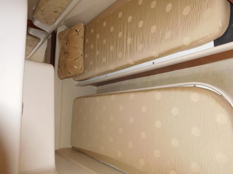 Slide: The Image of Interior seating of 2007 Regal 4080 Sportyacht with beige cushions. - 49