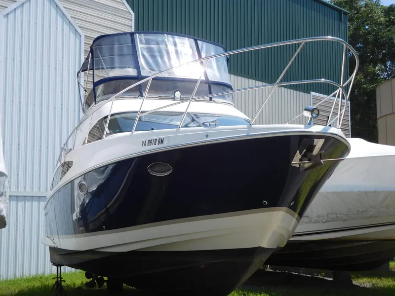Slide: The Image of 2007 Regal 4080 Sportyacht docked near storage buildings. - 6