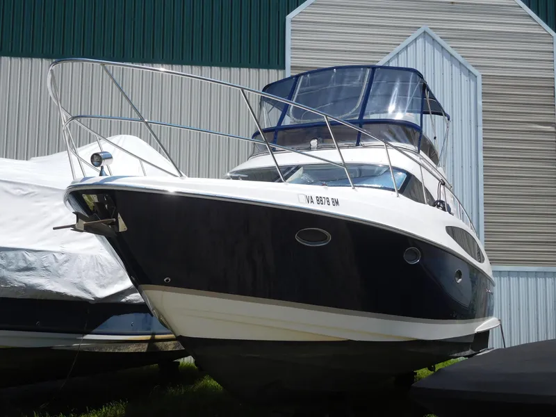 Slide: The Image of 2007 Regal 4080 Sportyacht docked near a boathouse. - 8