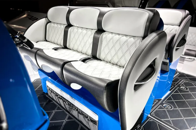 Slide: The Image of Luxurious seating on 2026 Nor-Tech 390 Sport boat, featuring elegant white and black upholstery. - 11