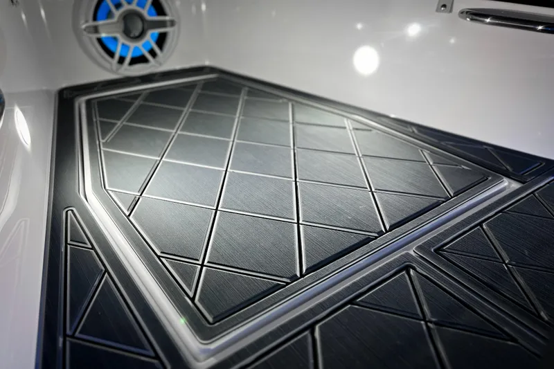 Slide: The Image of 2026 Nor-Tech 390 Sport boat interior with sleek, modern flooring and ambient lighting. - 16