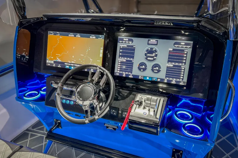 Slide: The Image of 2026 Nor-Tech 390 Sport dashboard with advanced navigation and control systems. - 6