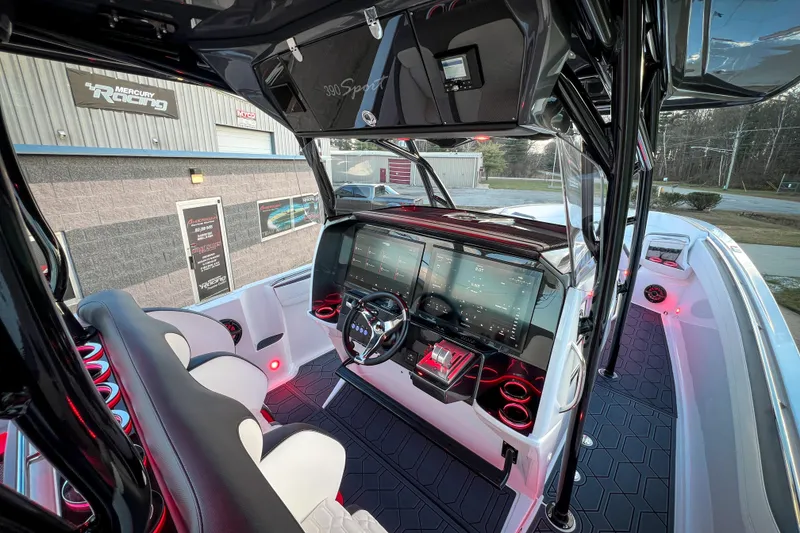 Slide: The Image of 2026 Nor-Tech 390 Sport boat interior with advanced navigation system and sleek design. - 8