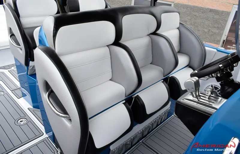 Slide: The Image of 2025 Nor-Tech 390 Sport boat interior with luxurious seating and modern controls. - 10