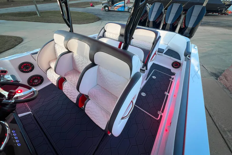 Slide: The Image of 2026 Nor-Tech 390 Sport boat interior with luxurious seating and modern design. - 13