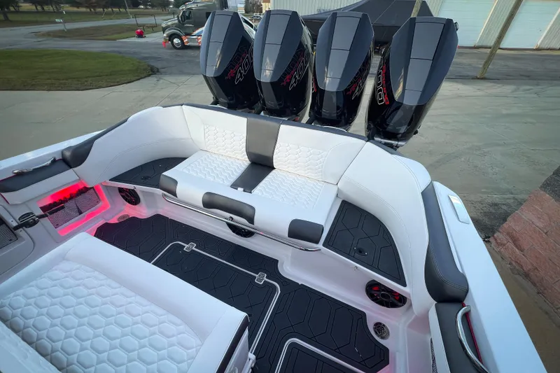 Slide: The Image of 2026 Nor-Tech 390 Sport boat interior with triple engines and luxurious seating. - 15