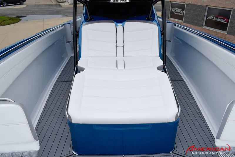 Slide: The Image of 2025 Nor-Tech 390 Sport boat with white and blue seating. - 18
