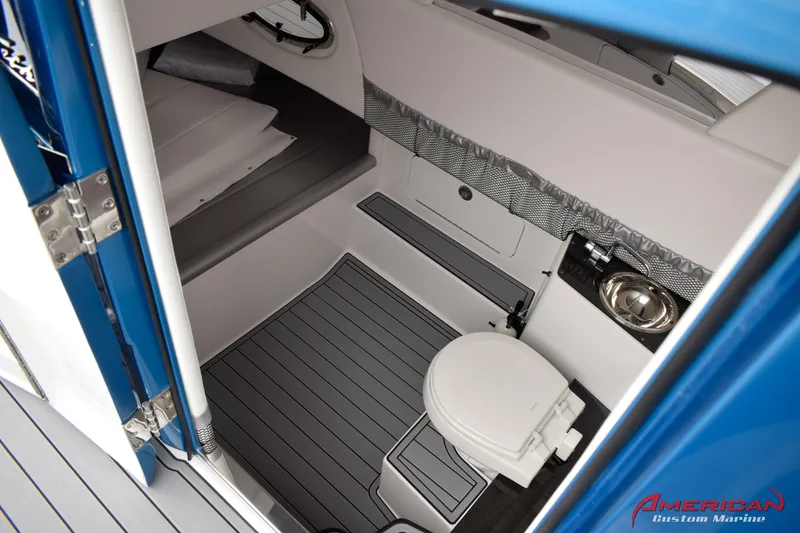 Slide: The Image of 2025 Nor-Tech 390 Sport boat interior with toilet and sink. - 21