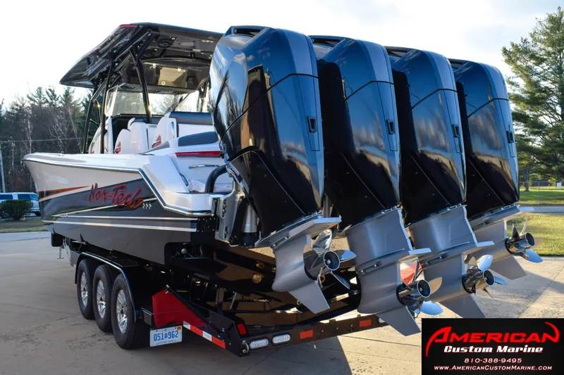 Slide: The Image of 2026 Nor-Tech 390 Sport boat with four powerful outboard engines on a trailer. - 5