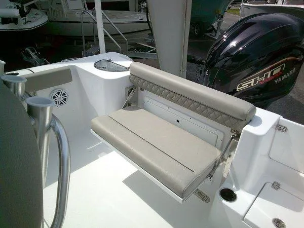 Slide: The Image of 2023 Sportsman 232 Open boat interior with cushioned seating and Yamaha engine. - 10