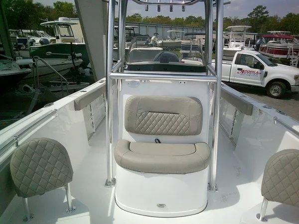 Slide: The Image of 2023 Sportsman 232 Open boat interior with cushioned seating and center console. - 11