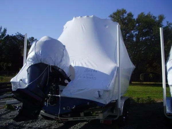 Slide: The Image of 2023 Sportsman 232 Open boat covered in white protective wrap. - 4