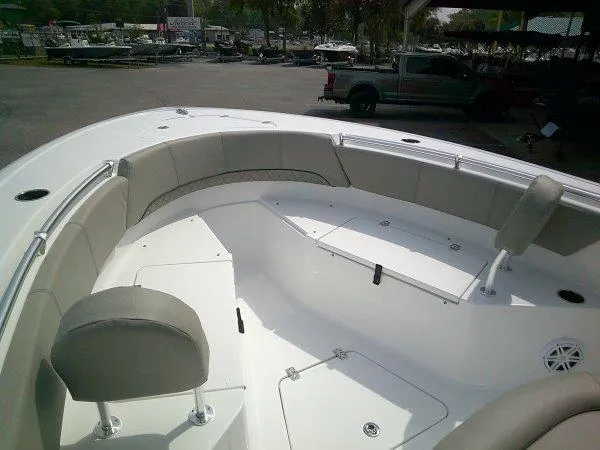 Slide: The Image of 2023 Sportsman 232 Open boat interior with cushioned seating and storage compartments. - 9