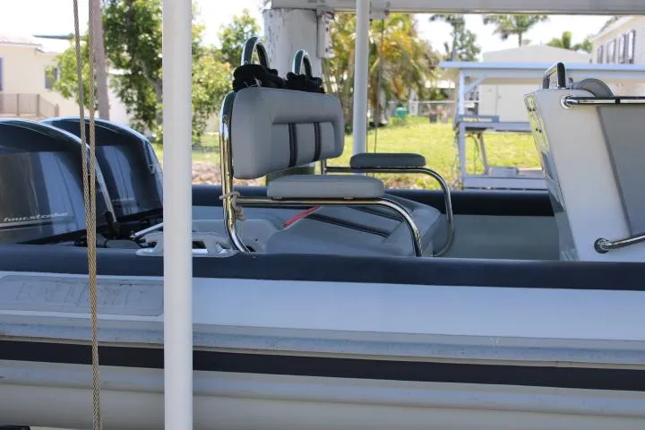 Slide: The Image of 2021 Ballistic RIB boat with dual outboard motors and cushioned seating. - 20