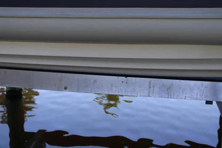 Slide: The Image of Close-up of a 2021 Ballistic RIB boat hull above water. - 27