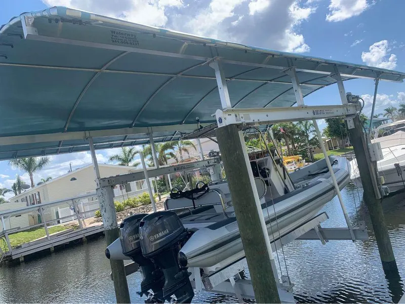 Slide: The Image of 2021 Ballistic RIB boat with Yamaha engines on a boat lift. - 3