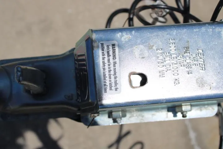 Slide: The Image of Close-up of a Ballistic RIB 2021 trailer hitch with warning label. - 30