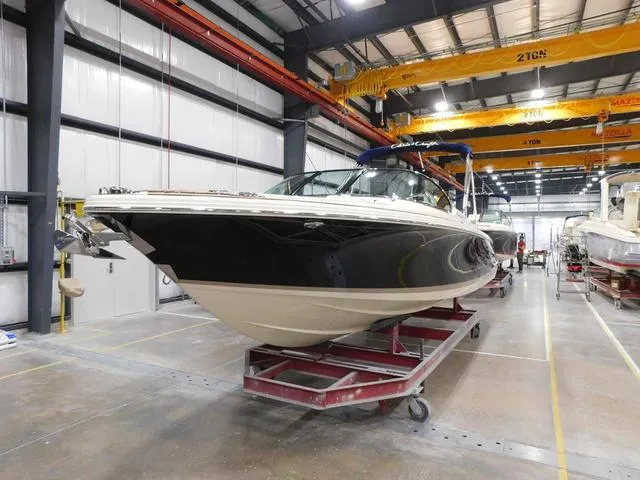 Slide: The Image of 2023 Chris-Craft Launch 25 GT boat in a warehouse. - 4
