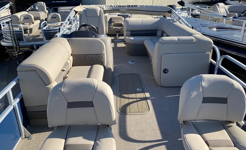Slide: The Image of 2023 Sun Tracker Fishin' Barge 22 XP3 interior with beige seating and spacious layout. - 4