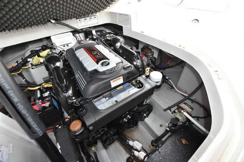 Slide: The Image of 2021 Crownline 264 CR engine compartment with a powerful inboard motor. - 12