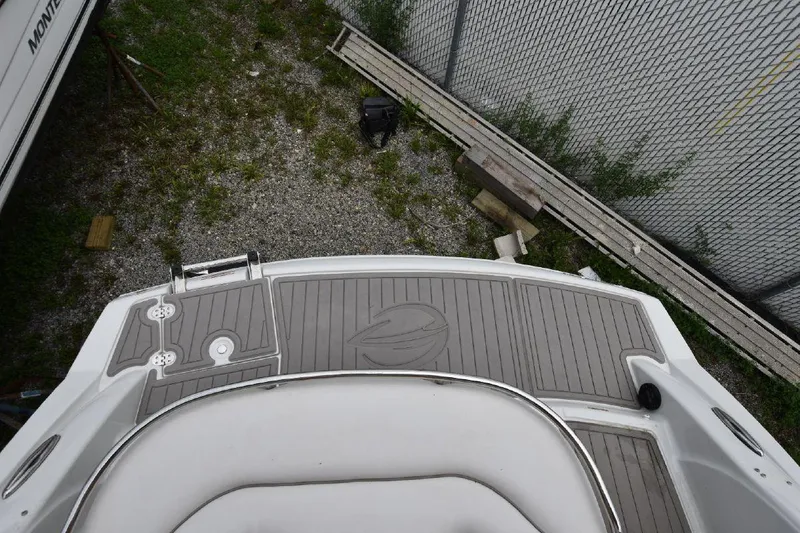 Slide: The Image of 2021 Crownline 264 CR boat stern view with swim platform and seating. - 16