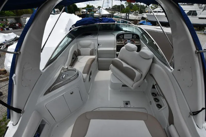 Slide: The Image of 2021 Crownline 264 CR boat interior with seating and helm. - 17