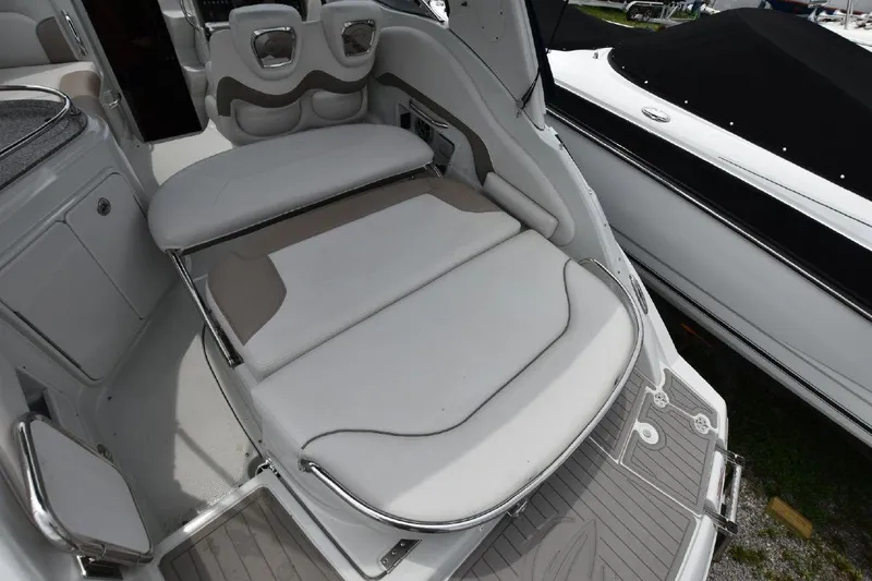 Slide: The Image of 2021 Crownline 264 CR boat interior with cushioned seating area. - 20