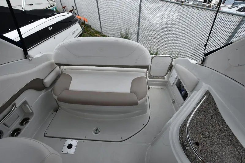 Slide: The Image of 2021 Crownline 264 CR boat interior seating area. - 22