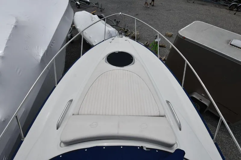 Slide: The Image of 2021 Crownline 264 CR boat bow with sun pad and railing. - 27