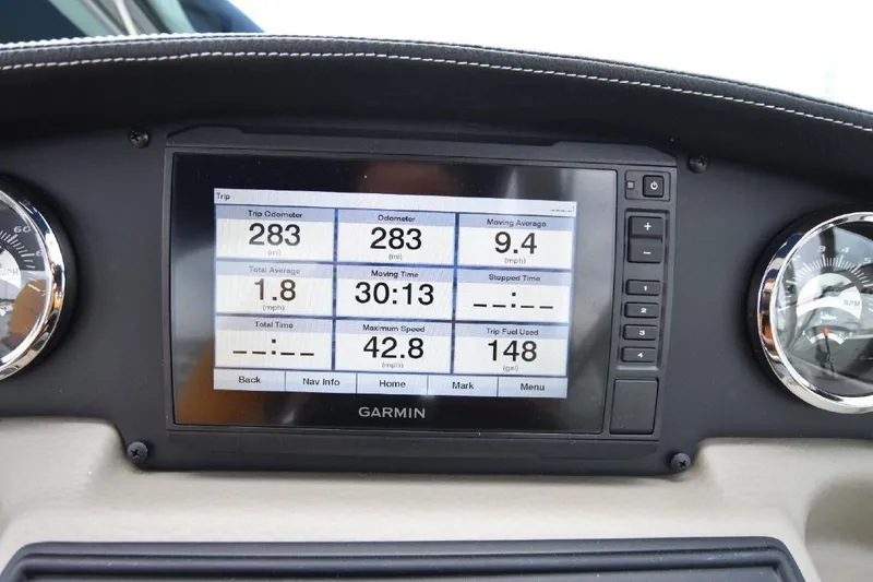 Slide: The Image of Garmin display on 2021 Crownline 264 CR boat dashboard showing trip data. - 29