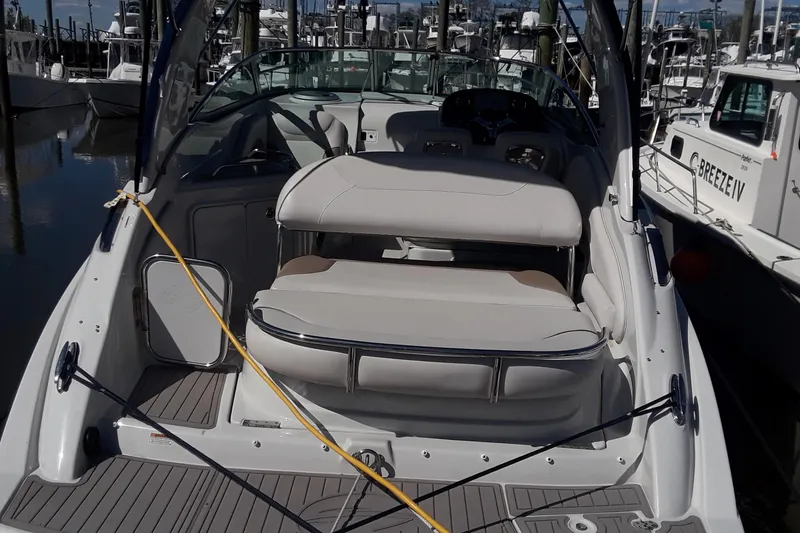 Slide: The Image of 2021 Crownline 264 CR boat interior at marina. - 32