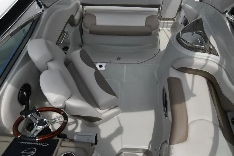 Slide: The Image of 2021 Crownline 264 CR boat interior with seating and steering wheel. - 33
