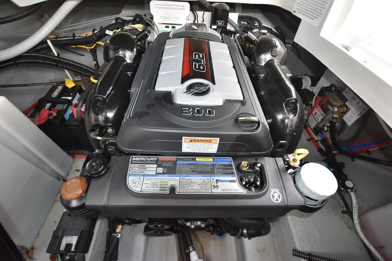 Slide: The Image of 2021 Crownline 264 CR engine compartment with a 6.2L Mercury engine. - 38