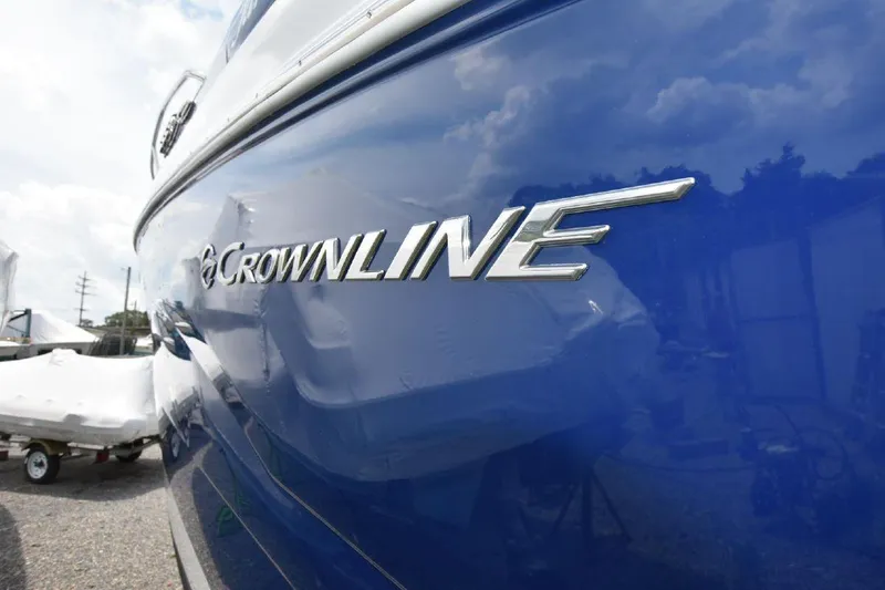 Slide: The Image of 2021 Crownline 264 CR boat side view with logo. - 43