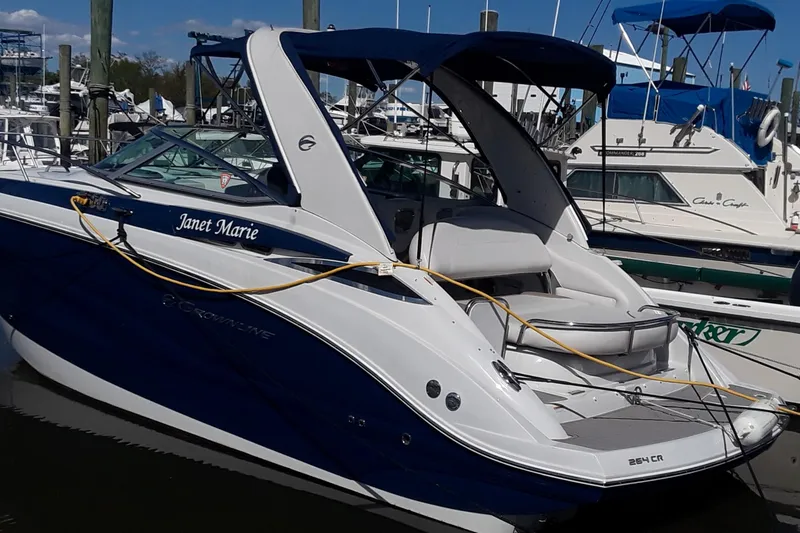 Slide: The Image of 2021 Crownline 264 CR boat docked at a marina. - 45