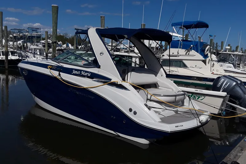 Slide: The Image of 2021 Crownline 264 CR boat docked at marina. - 46