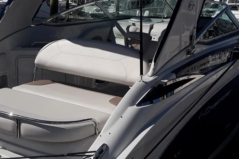 Slide: The Image of 2021 Crownline 264 CR boat interior with white seating and sleek design. - 47